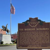 Sheridan Historical Market on Pubic Square with statue of Philip Sheridan in background