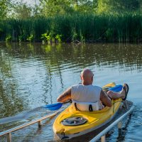 Kayaker pushing into water at the Buckeye Lake Canoe and Kayak Launch in Thornville, Perry County, Ohio.