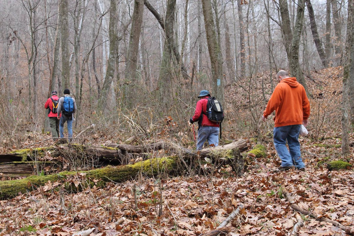 Hikers in winter woods on the Buckeye Trail in Perry County, Ohio.