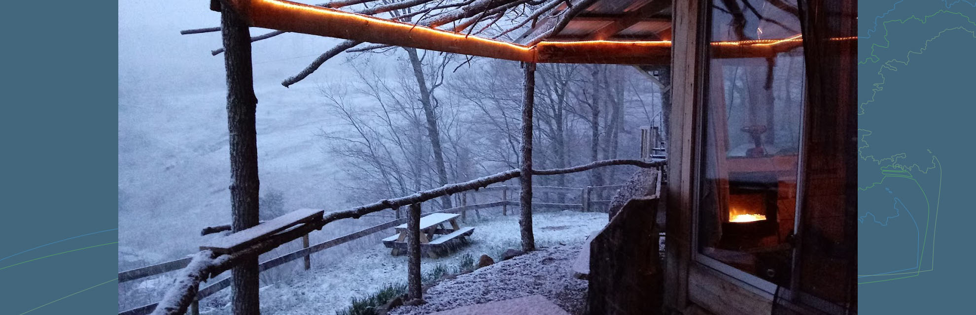 Winter scene with snow and outdoor fire at Hidden Gems Cabins in Perry County, Ohio.