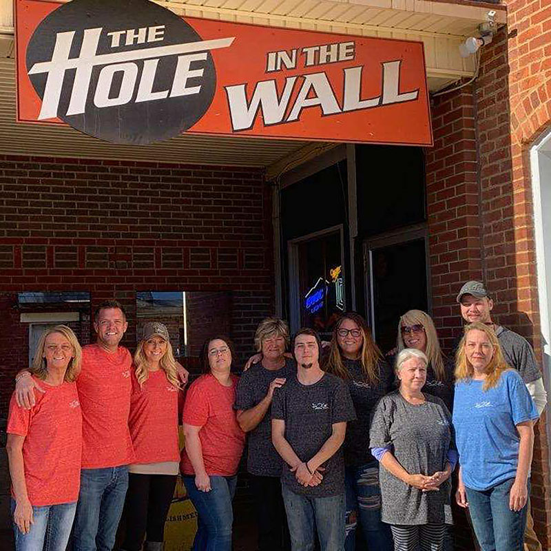 The Hole In The Wall team standing at the entrance in Somerset, Perry County, Ohio.