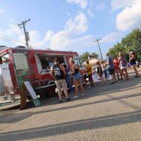 People gathered outside the Mt. Airy Beef Food Truck.