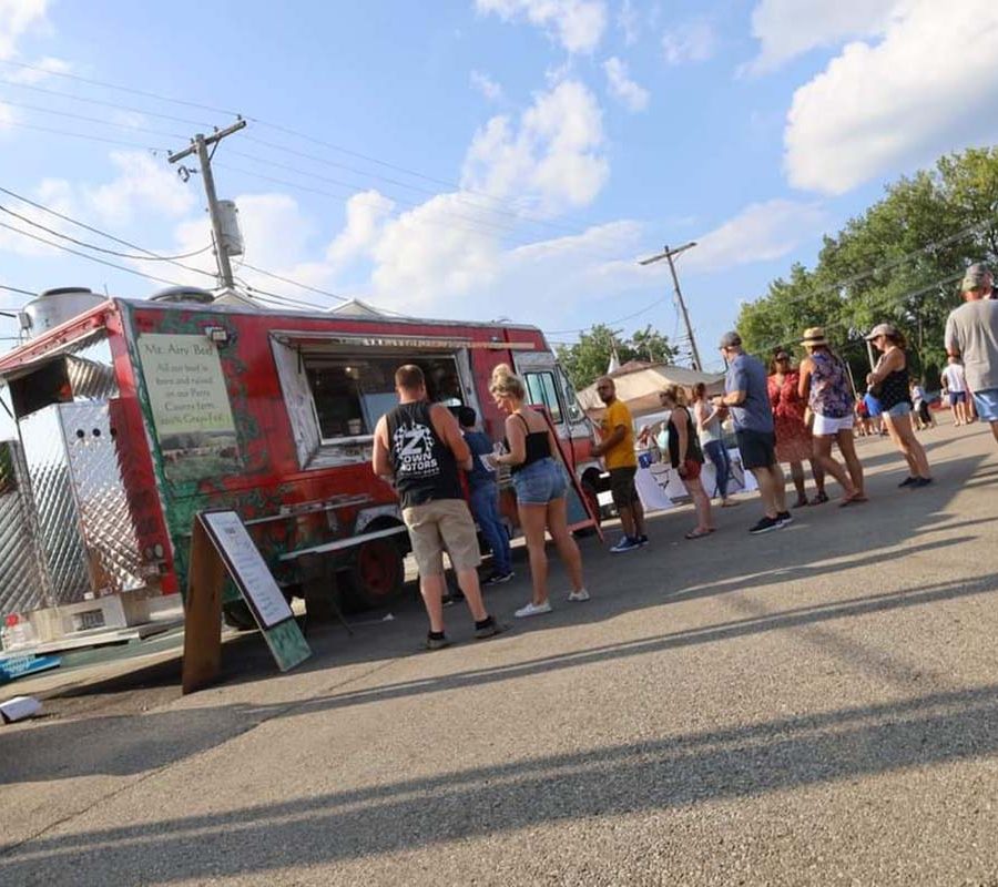 People gathered outside the Mt. Airy Beef Food Truck.