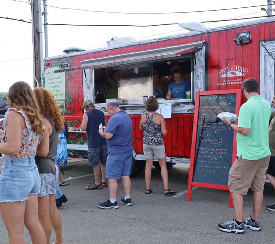 People gathered outside Mt. Airy Beef Food Truck.