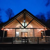 Nighttime exterior of cabin at Peek-A-Boo Cabins, Hocking Hills, Perry County.