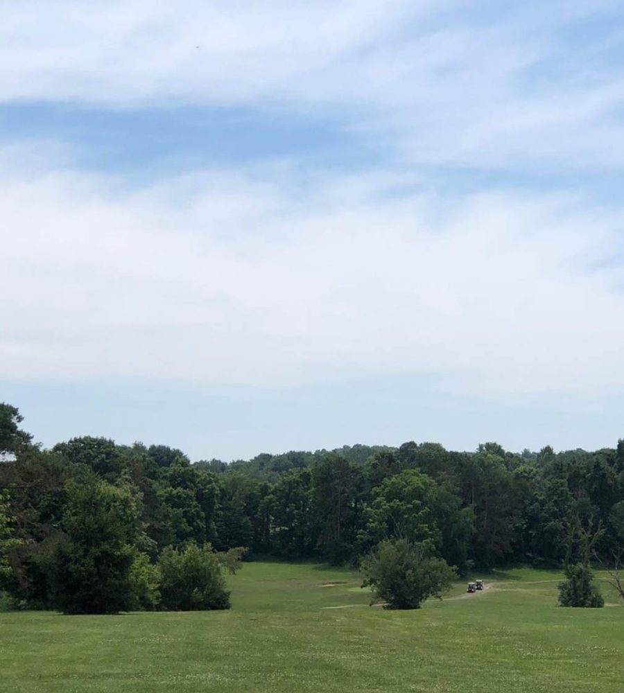 Aerial view of rolling greens and treeline at Perry Country Club, New Lexington, Perry County, Ohio.