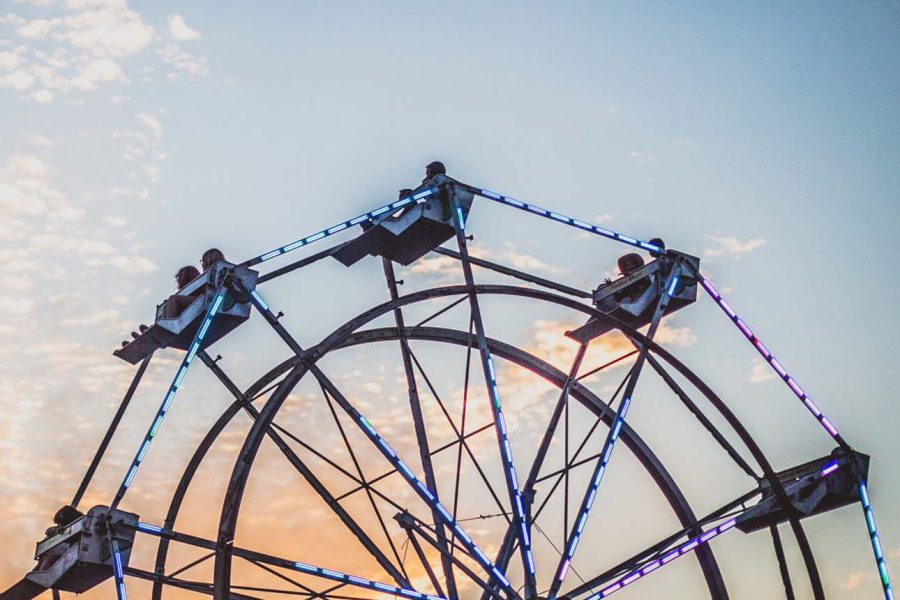 People riding Ferris Wheel at dusk at the Perry County Fair in New Lexington, Ohio