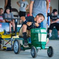 Child riding miniature tractor at the Perry County Fair in New Lexington, Ohio