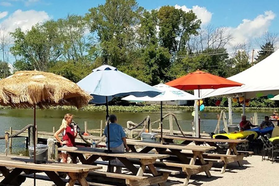 Dockside picnic tables with umbrellas at The Port Lounge & Smokehouse in Thornville, Perry County, Ohio.