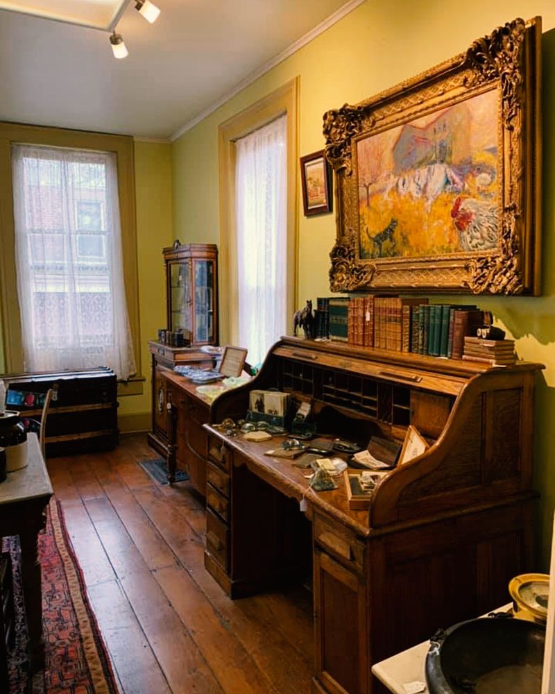 Antique desk and artwork on display at Somerset Art & Antiques in Somerset, Perry County, Ohio.