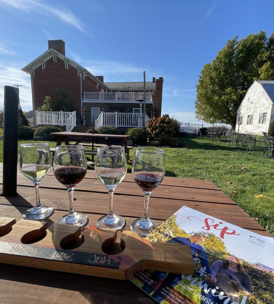 Tasting presentation of four glasses of wine outdoors at Vinberige Vineyards in Thornville, Perry County, Ohio.