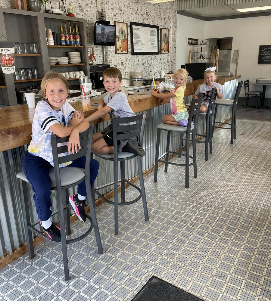 Four children seated at the lunch counter at The Corner News in downtown New Lexington, Perry County, Ohio