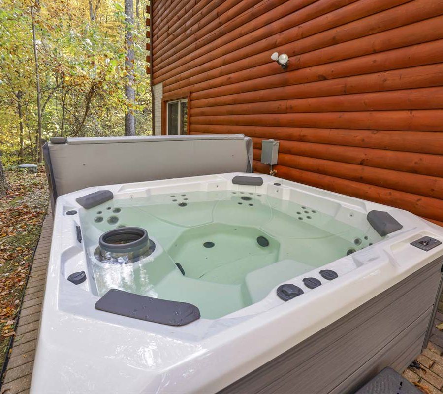 Hot tub on side of cabin at Honeybee Hideaway in Logan, Monday Creek, southern Perry County, Ohio