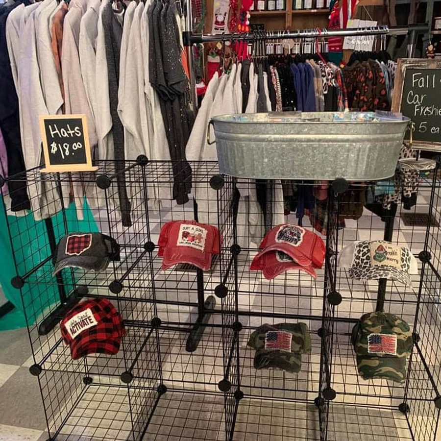 Sweatshirt and logo hats on display at Seals Flowers & Gifts in New Lexington, Perry County, Ohio