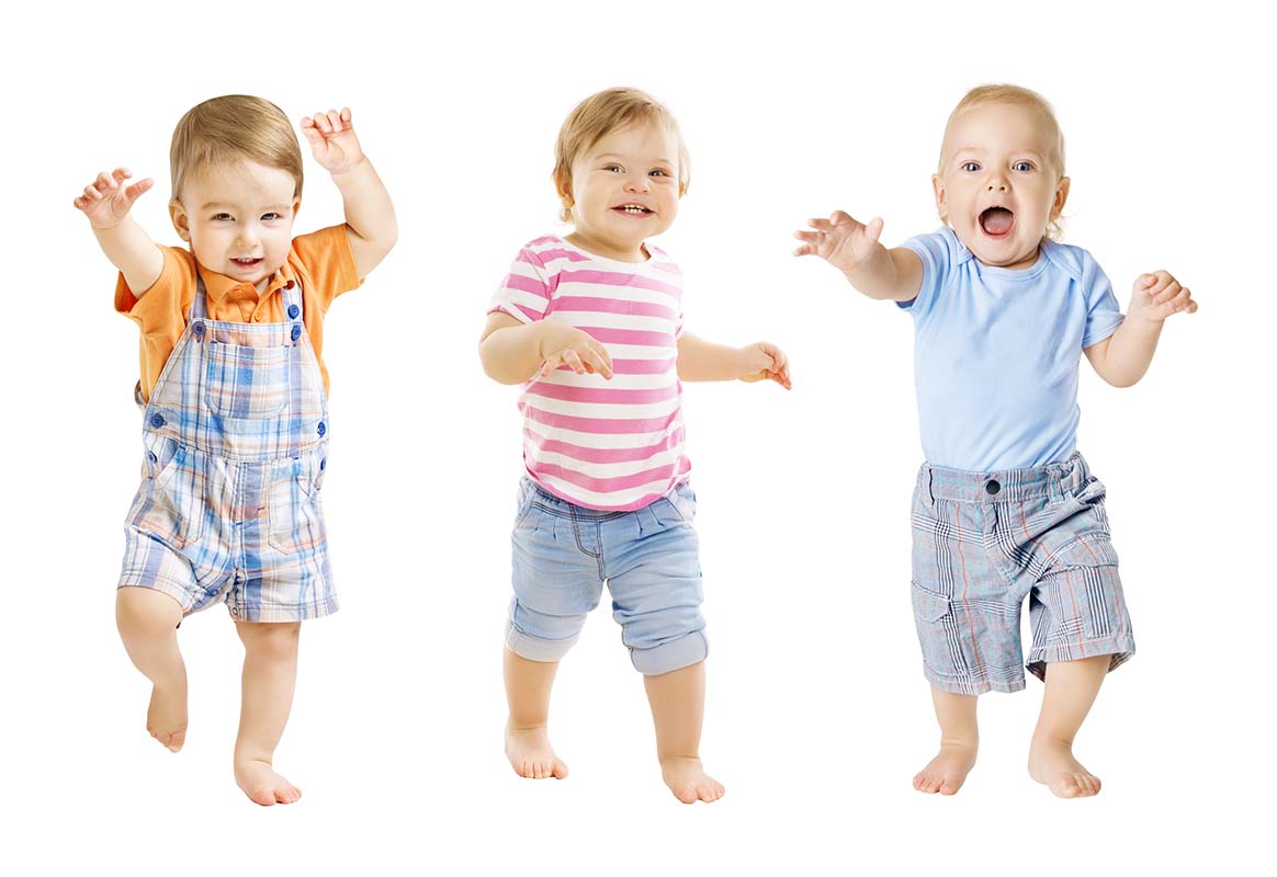 Three dancing, laughing toddlers