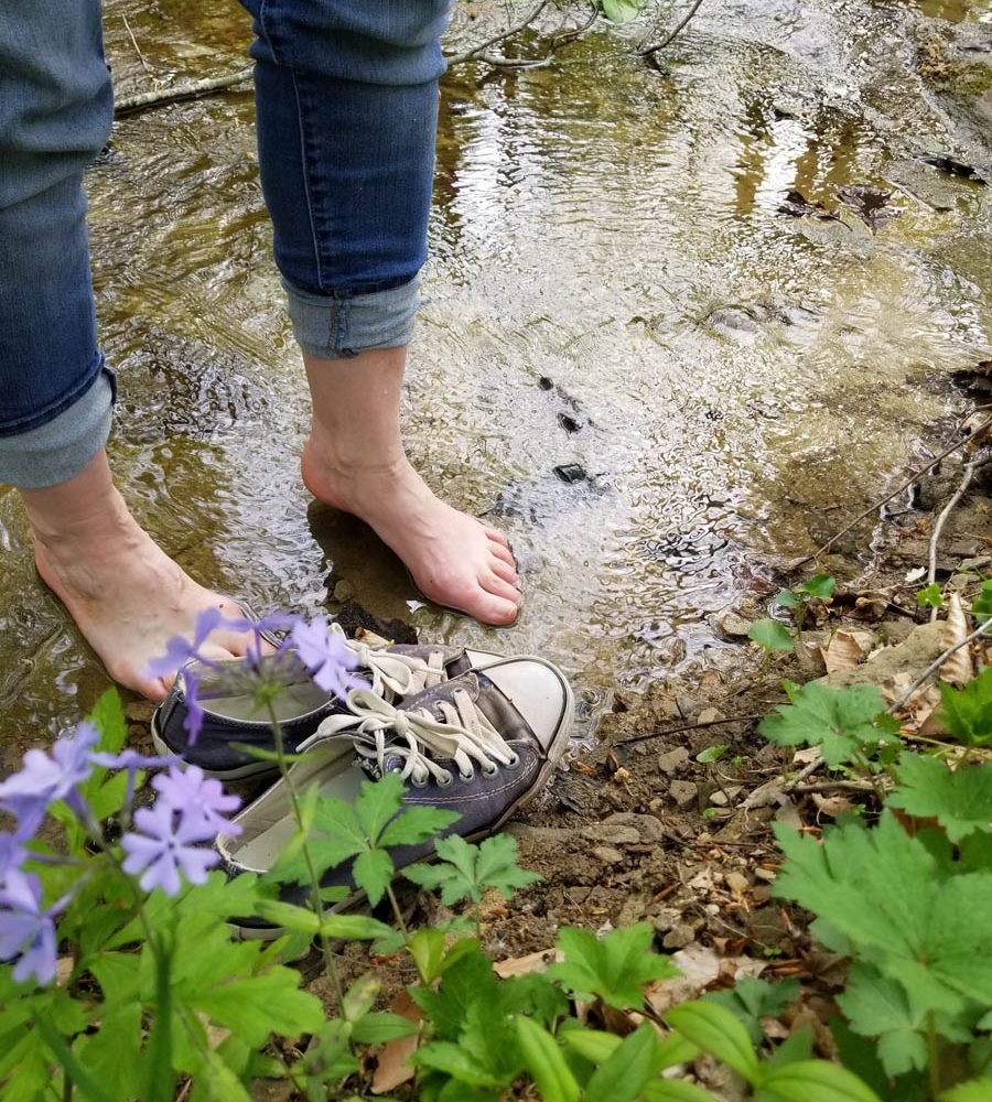 Woman's feet in shallow water