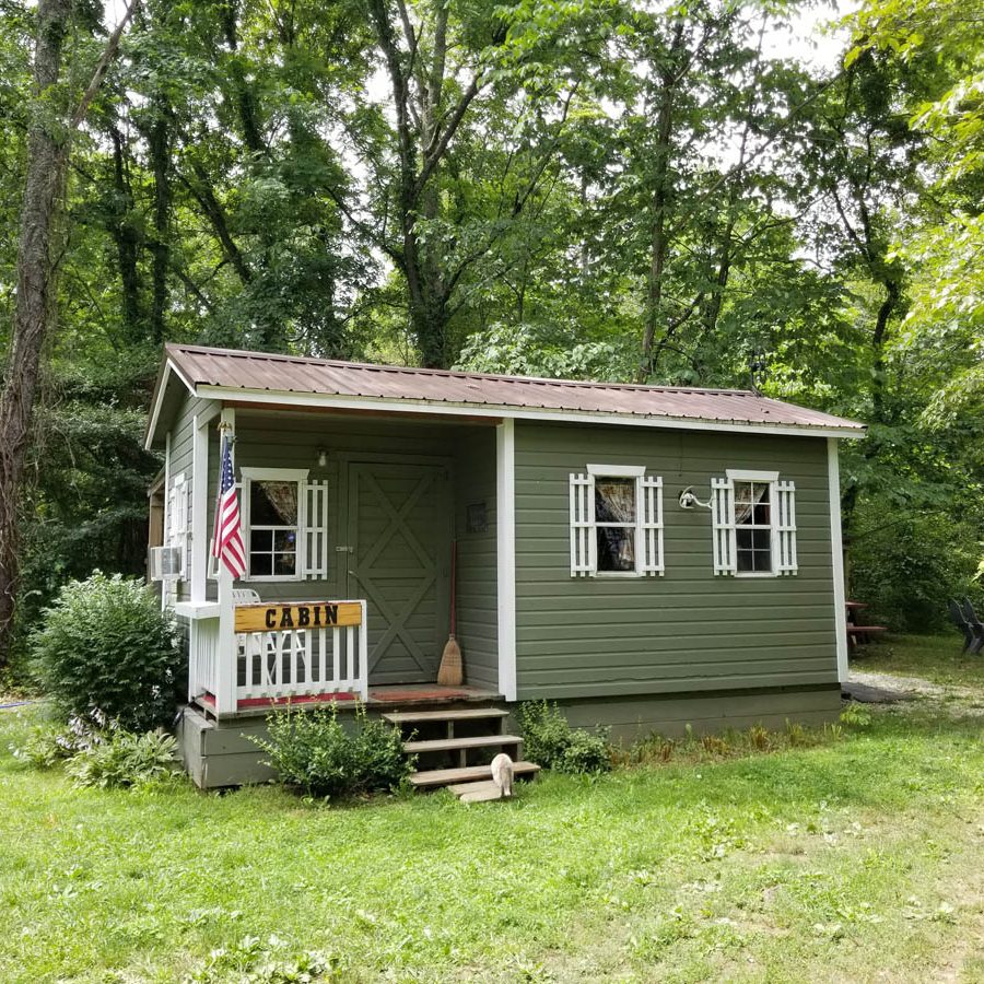 Guest cabin under trees at Acres of Nature in Perry County, Ohio.