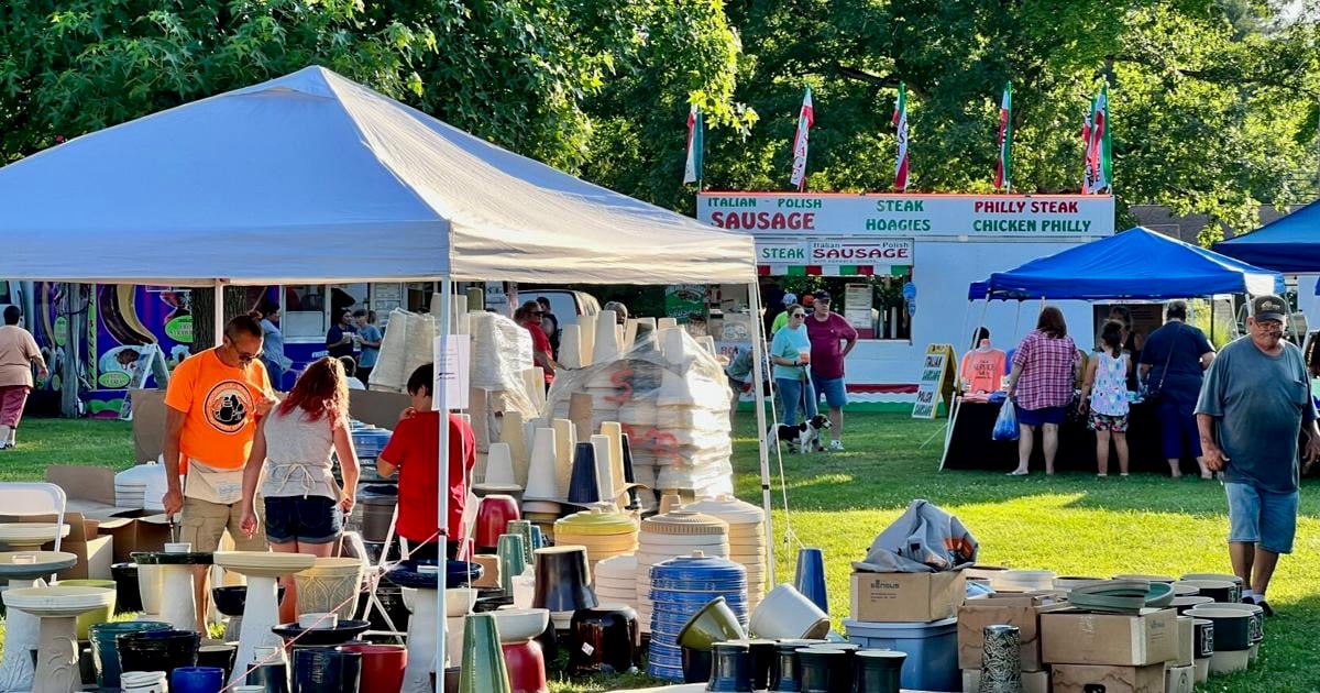 Vendors get their tents set up for Pottery Fest.