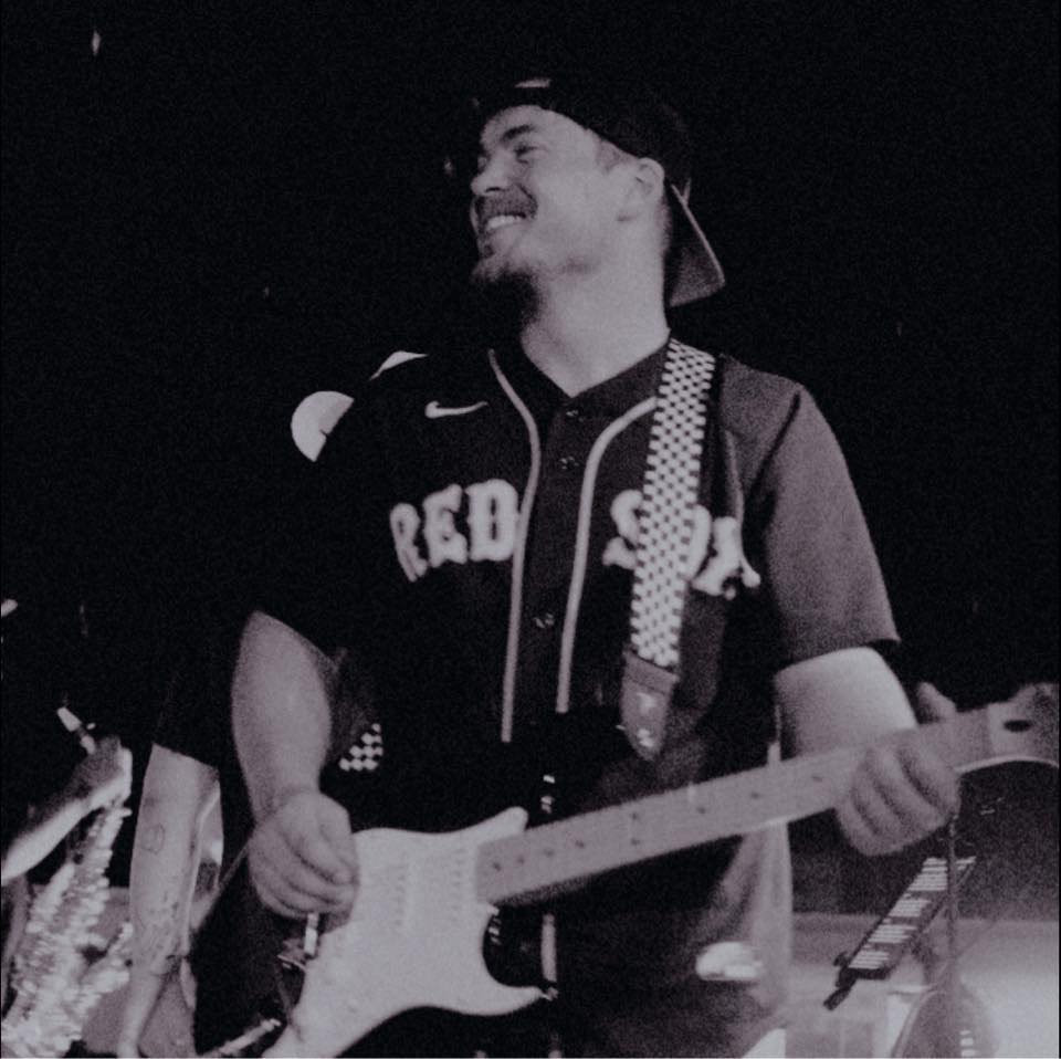 Angelo Snyder playing guitar