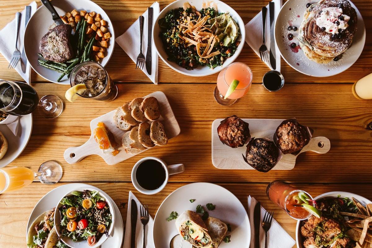 A table filled with meals featuring ingredients sourced locally from Shawnee Farmers Market Vendors.