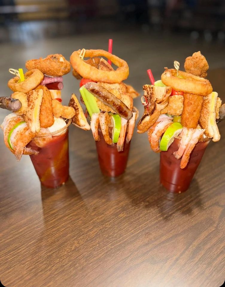 A close up of three Loaded Bloody Marys.